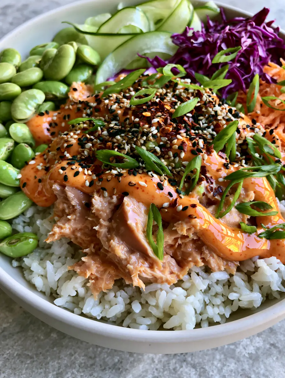 Canned Tuna Bowl: The Ultimate 15-Minute Luxury Pantry Meal 3 High-angle shot of a vibrant Canned Tuna Bowl in a white ceramic bowl with shredded carrots and purple cabbage. (Canned Tuna Bowl)