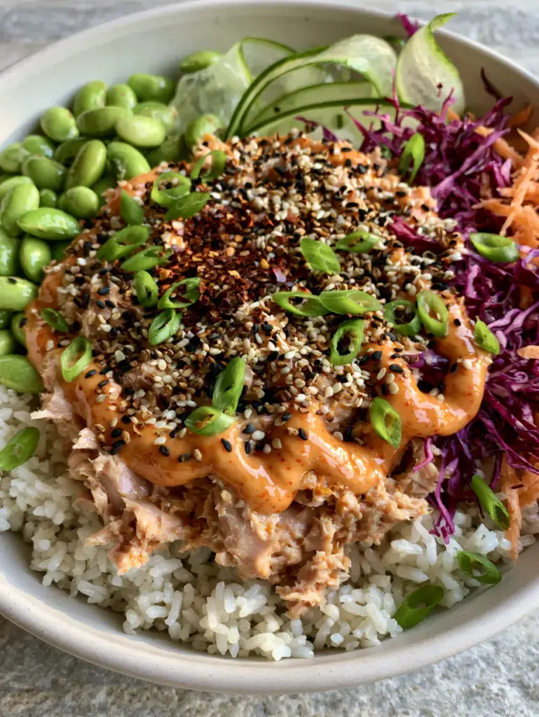 Canned Tuna Bowl: The Ultimate 15-Minute Luxury Pantry Meal 1 Detailed close-up of individual jasmine rice grains topped with flaky white tuna and black sesame seeds.