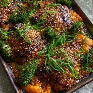 Extreme top-down view of Ginger Garlic Chicken Thigh Bake showing caramelized edges and translucent glaze.