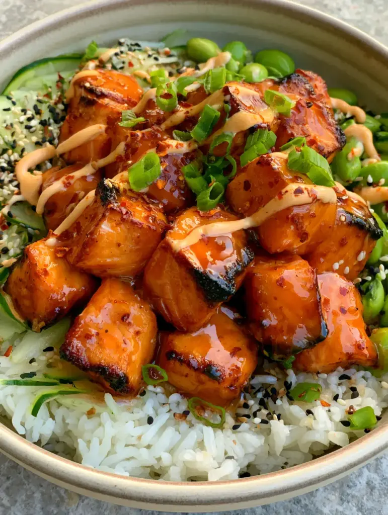 Sriracha Honey Salmon: The Ultimate Crispy Air-Fried Rice Bowl 1 A smartphone-style photo of a Sriracha Honey Salmon bowl on a stone countertop with natural side lighting.