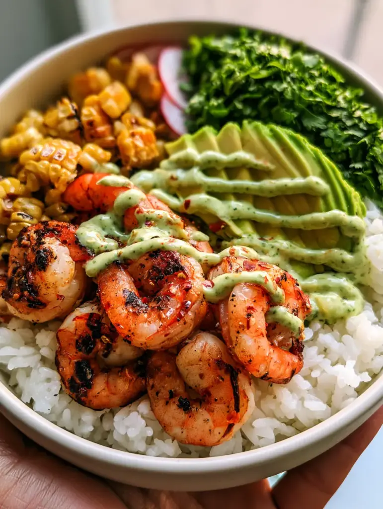 Close-up of charred sweet corn and translucent red radish slices in shrimp and avocado bowls.