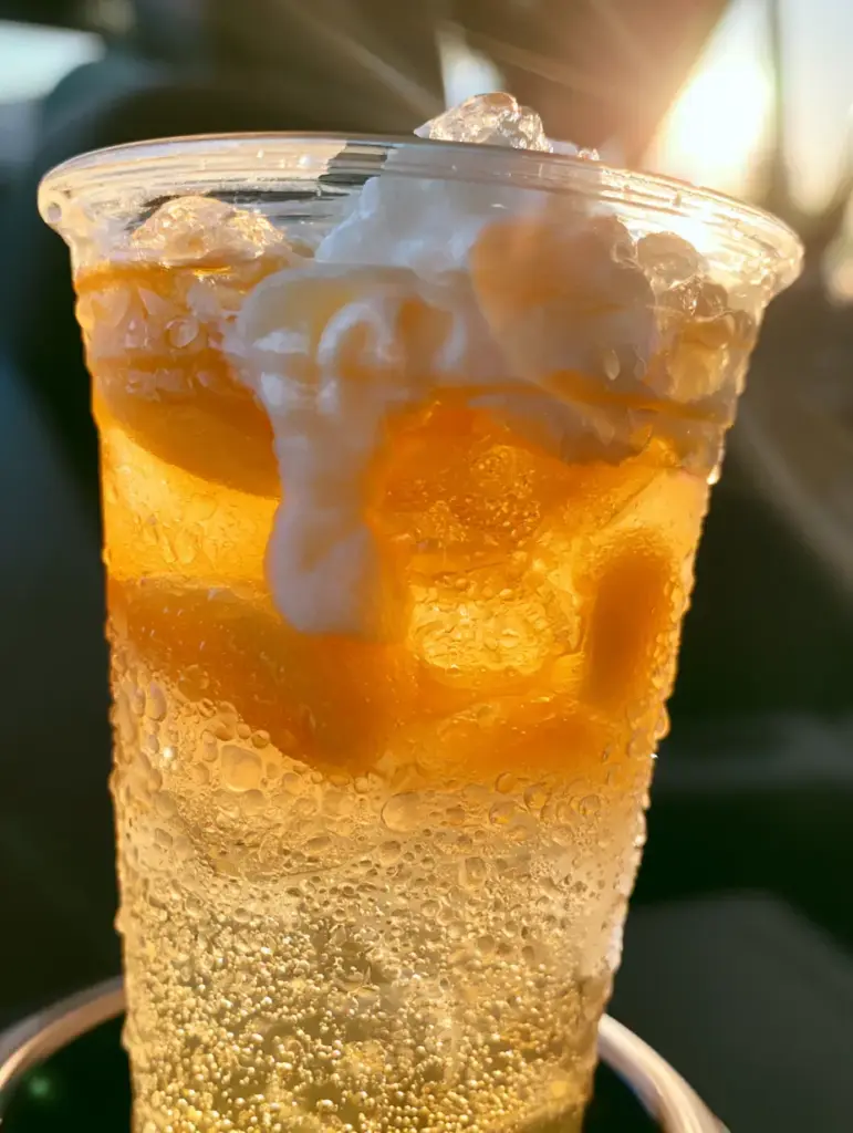 A side view of the peach drink showing the frozen peach slices and pebble ice. (Sonic Princess Peach Drink)