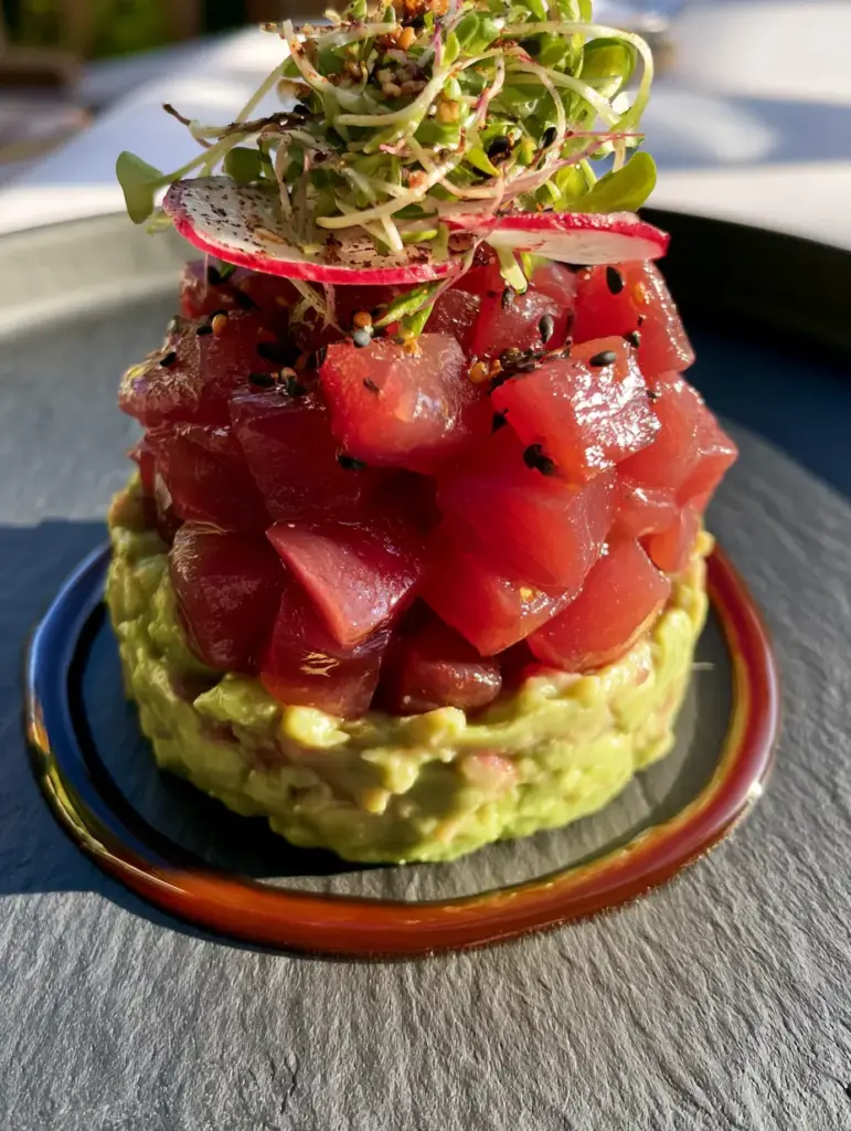 Nobu Tuna Tartare Recipe: The Ultimate Avocado Stack Tutorial 1 Bird's eye view of the Nobu Tuna Tartare stack showing the radish slices and toasted black sesame seeds.