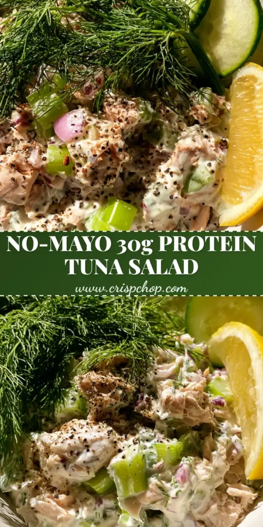 A top-down view of high protein tuna salad in a white bowl with fresh dill, cucumber slices, and a lemon wedge.