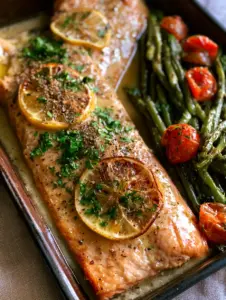 High-angle shot of flaky trout recipes fillets with shimmering herb butter and blistered green beans.
